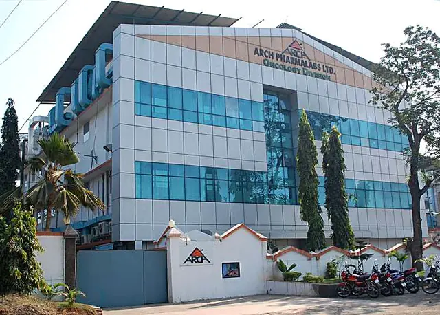 Arch Pharmalabs building with a blue glass facade