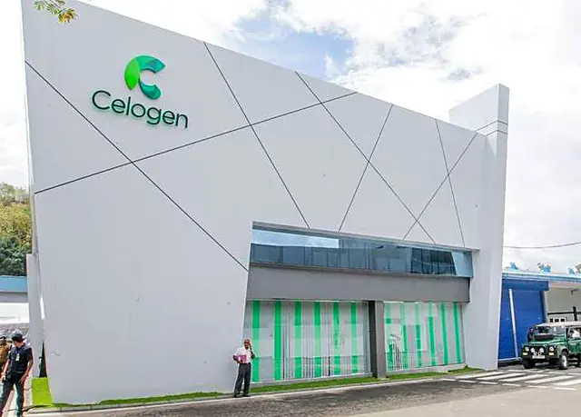 Modern white factory building with the Celogen logo