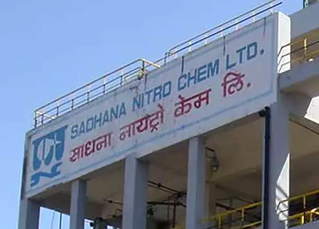Sadhana Nitro Chem building with its name in English and Hindi
