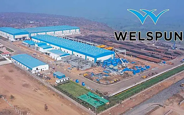 Aerial view of a large textile plant with the Welspun logo