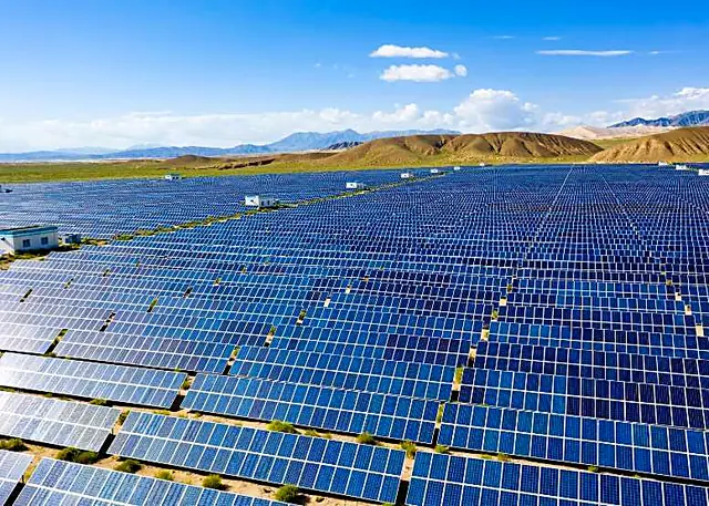 Large solar plant below hills