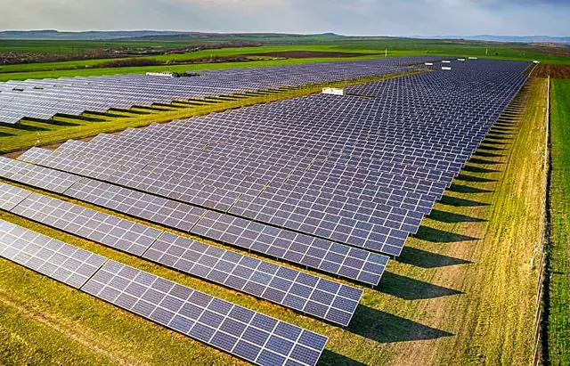 Rows of solar panels across farmland
