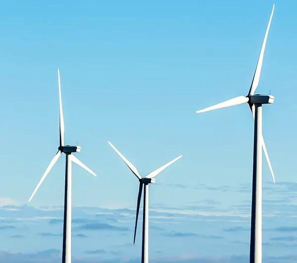 Wind turbines against a blue sky